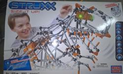 Excellent condition; it's been opened but never assembled. A great toy for the child that likes to build. A great toy for a child to pre-teen.
Retails for $65 US. (http://www.amazon.com/Mega-Brands-06001U-Struxx-Robotrixx/dp/B00175YUBC)