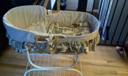 moses bassinet on stand, comes with matress and bedding which is all machine washable. comes from a non smoking and pet free home.