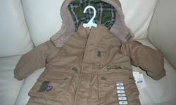 Really nice and warm, brand new khaki coloured coat with pockets.  Was a gift that is not needed.  Green plaid-lined hood, with faux fur trim.  Perfect for a holiday gift, or to keep a kid warm for the winter.