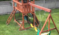 Excellent condition, playhouse, climbing wall, slide, 2 swings, glider, sandbox underneath, 2 stools, chalkboard, flower planter and flag pole. Needs partial disassembly to move.