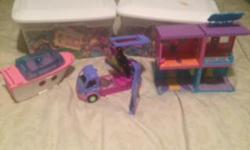 This is a ton of polly pocket dolls, clothes and misc items. There is a house, an apartment, camper van and a boat