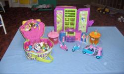 An assortment of Polly Pocket dolls, 2 scooters, car, helicopter, storage closet and a store.  Very good shape!  Daughter has outgrown them.