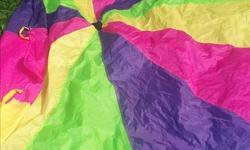 Large parachute...awesome for kids to play with! In mint condition.