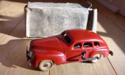 For Sale: "Lucky Car" windup tin car, made in Occupied Japan, vintage late 1940s. This is a highly collectible toy in very good to excellent condition. The windup motor works well and the key is included.  Even the original but very flimsy box is