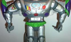 Rare Toy Story Buzz Lightyear Action Figure Alarm Clock Disney Pixar 12.5" tall
Face shield opens and closes. Buttons on chest can be pushed to hear phrases. Button on arm activates laser lights and sounds.
Takes three AA batteries (included)
It is