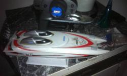 Insane mini-c boat , running a Losi 2.4 spectrum radio and receiver , a crazy 1/16 mamba brushless system , runs nihm and lipo battery's . Goes about 80kmh on the water . If it doesn't backflip on take off because of the upgraded mamba motor and electonic