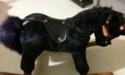 I have a Rocking horse suitable for a toddler/preschooler. Its Black and beautiful. The bottom does hvae some scuffs and chips on it, but other than that its in great shape. When you press one of his ears he naaah's and when you press the other ear he