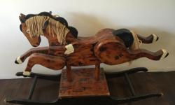 This wooden rocking horse could easily hold an adult. It's very solid & safe & a good size. Holds a couple kids, no problem. I always meant to refinish it but now we've moved & don't have room for it. Pet free smoke free home. We live in Shawnigan Lake.