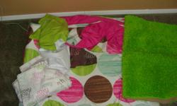 This includes a twin comforter and sham, a sheet set, a bed skirt, a window valance and a green rug