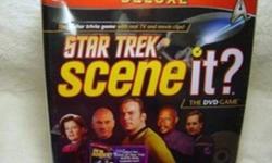 Perfect Christmas Gift! Star Trek Scene It DVD game - DELUXE Edition. Still in original wrap. Perfect condition. Great for the Sci-Fi fans on your Christmas list, or the person who has everything. The Deluxe Edition includes Bonus Trivia cards, Star Trek
