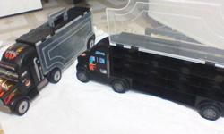 Semi trucks, drive carry 26 cars each, carry case but semi is moveable.
Good condition