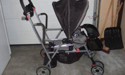 Joovy Caboose sit and stand stroller.  Perfect for two kids.  Can be used with infant car seat.  Like-new condition.