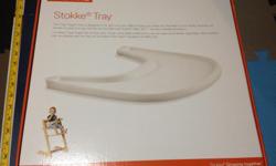 White Stokke Tray table for Stoke chair for sale. Original packaging included. It was used for one child and always kept exceptionally clean. A great deal for half the price of a new one.