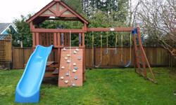 Great playset from Costco. Our daughter has grown out of it but had a ton of use from it. Time to pass along the fun to someone else. Comes with rock wall, two swings, baby swing, bar swing, picnic table with bench's, monkey bars, covered fort that is
