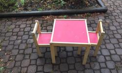 Square crafts/outdoor table with two sturdy chairs.