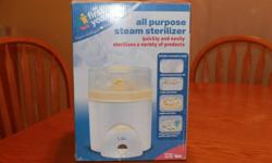Steam bottle sterilizer, in great condition. Includes all pieces and has inserts for both large and regular size bottles.