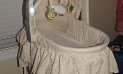 great bassinet, neutral colors, vibrates, music, light, removable bassinet with change table underneath. Straps in bassinet so you can carry baby in it.