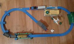 Tracks are plastic and reversible.These are two sets mixed together. The one shown has the airport and a hill up to a bridge. The plane goes around when Thomas stops at the station. The other one has a water tower, small hill and a larger track set up.