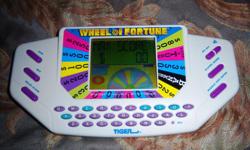 Handheld Wheel Of Fortune game Play anywhere at anytime
There are no scratches or visible damage to the game
Requires 4 'AA' size batteries (not included). Measures 4" X 8.25"
It is like-new and barely used Very clean Works Perfect! Excellent condition