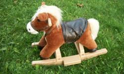 pony with saddle and bridle, 19 inch tall to the neck and 14 inch to the back .  ready to be rocked by a toddler.   call 604 858 6955