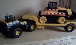 tonka truck with trailer and backhoe..as new.retails.over 50.00.goosebumps books.and othrs like new 35 plus books..like.new.20.00,  ..learning toy with 6 books and cartridges.with case..15.00 great shape..