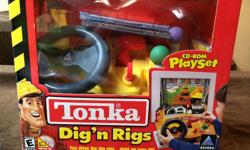 Tonka Digs n Rigs Playset, straps onto keyboard and child can drive the trucks. Extra CD included.