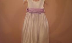US Angels Flower Girls Dress available size 3T.  Dress is white in colour and comes with a lilac colour sash.  Used by my daughter for one wedding, no reception.  Purchased brand new from Nordstrom`s and worn for 2 hours (ceremony and pictures).  Sash can