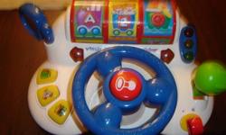 V-Tech Learn and Discover Driver has lots of different sounds and colors. Once you turn the key you can press the button for the police car, gas station or radio. When you turn the wheel it also turns the three rollers at the top like a slot machine to