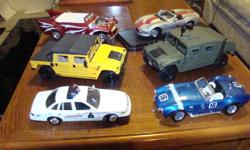 I have for sale the following Diecast vehicles without boxes, displayed not played with:
1:24 Ford Crown Victoria RCMP Patrol Car    5.00
1:18 Majorette Shelby Cobra 427 S/C              5.00
1:18 AutoWorld Grease Movie Car                   10.00
1:18