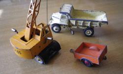 This is a lot of three (3) Dinky Super Toys from the mid-1960's made in England by Meccano Ltd. The lot consists of a Euclid Rear Dump Truck, model #965, a Coles Mobile Crane, model #971 and a Land Rover Trailer, model #341. Great for a collector.