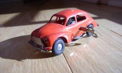 For Sale:  Tri-ang Minic windup car, vintage probably late 1940s to early 1950s.  This is a highly collectible toy in very good to excellent condition.  The windup motor works well and the key is included.
This rare collectible toy is priced very