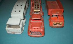 vintage metal trucks structo car carrier (no cars), buddy L  fire truck,  and  a straight truck, make unknown