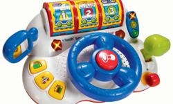 Interactive steering wheel controls movement of 3 jumbo learning rollers that teach numbers, letters, animals, colors and shapes Dashboard stoplight and gas pump, police siren and radio press buttons feature fun phrases and sound effects Moving rear-view