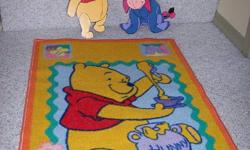 Area rug, 2 ceramic Winnie the Pooh book weights, 4 decorative wooden characters that can be hung on the walls.
