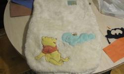 I have a white car seat bag to go.  It has winnie the pooh on the outside and printed with brown winnie the pooh on the inside.  It's been freshly washed and is ready to go today.  5$ firm takes this lovely warm bag.  Pick up only please.