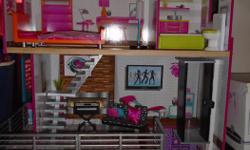 Barely ever used like new Wooden Doll House with all the accessories. My daughter doesn't use it and I need the space.