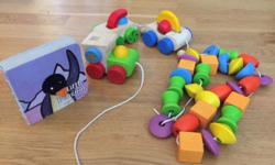 These are good quality wooden toys by Plan Toys. There is a train and a wooden beaded necklace. Both are good condition, also this comes with a Penguin book too. From a pet free, smoke free home.