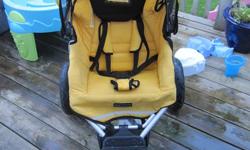 Yellow Quinny Jogging stroller. This is a wonderful jogging stroller that is super comfortable for your child with lot's of padding on the seat and headrest.
-Great shock system.
-Large rubber tires with front tire that can be locked or slightly pivet.